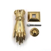 Brass door knocker in the shape of a hand, 1970s.