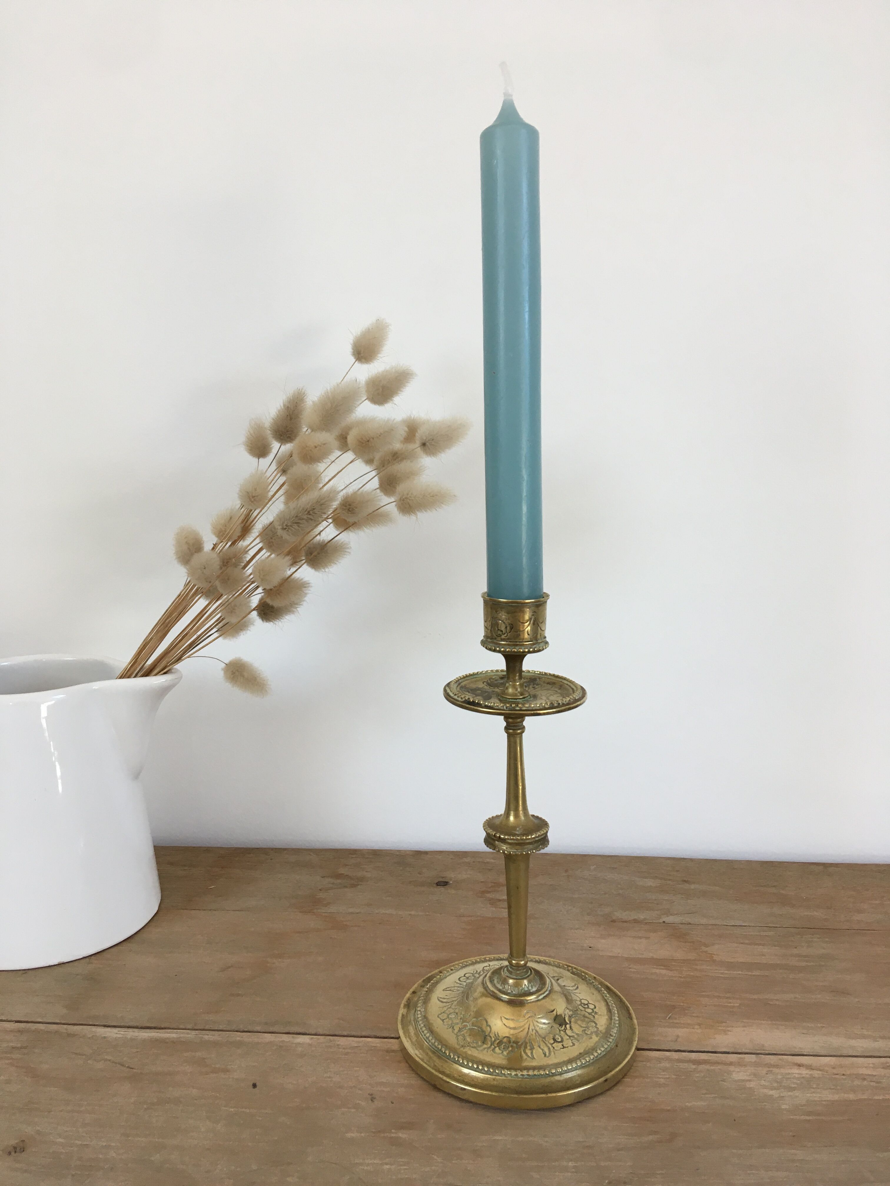 Chiseled brass candle holder