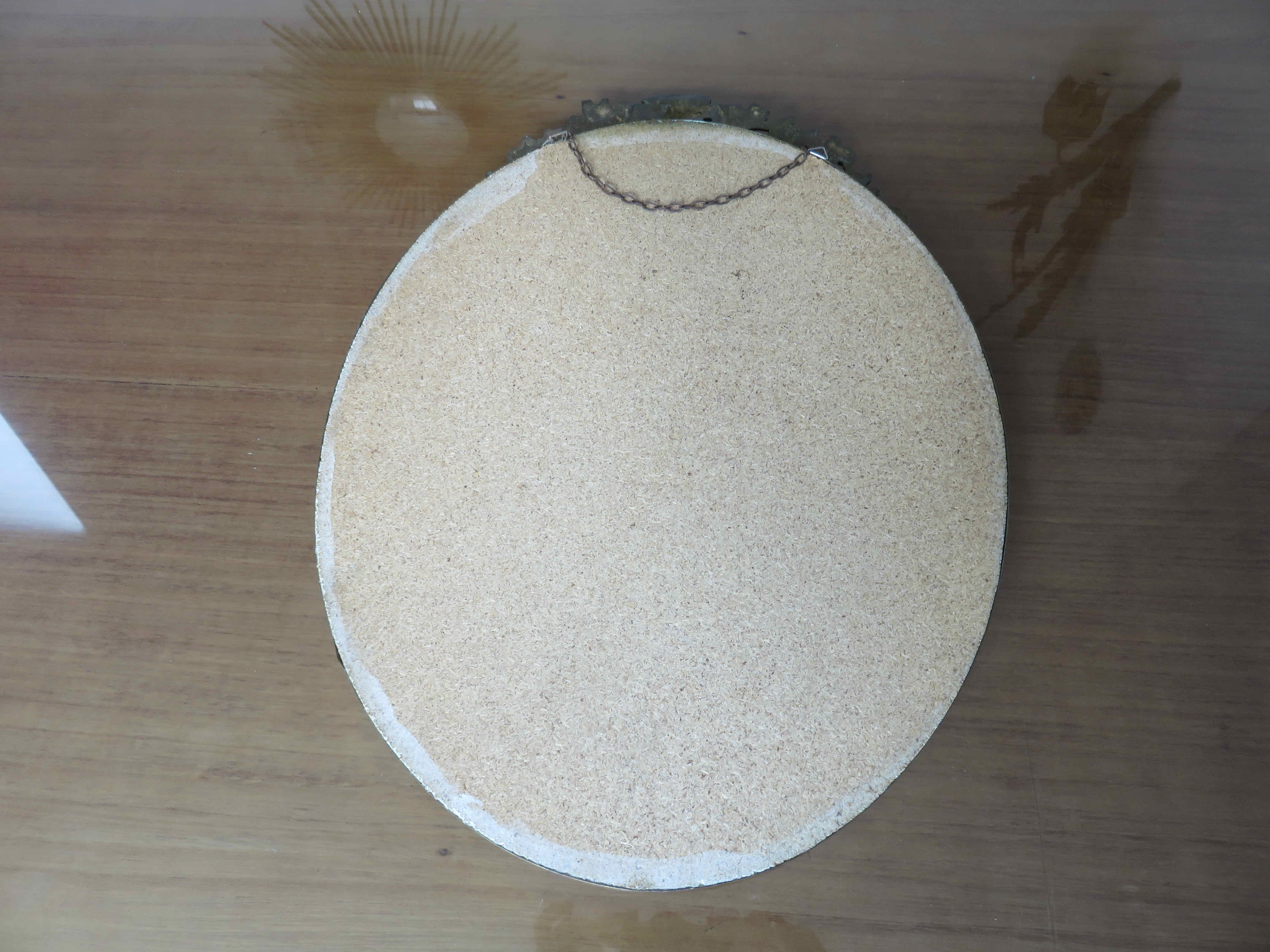 Oval mirror in gilded brass with frieze 40s 50s, 37x50 cm