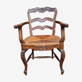Chair with wooden armrest