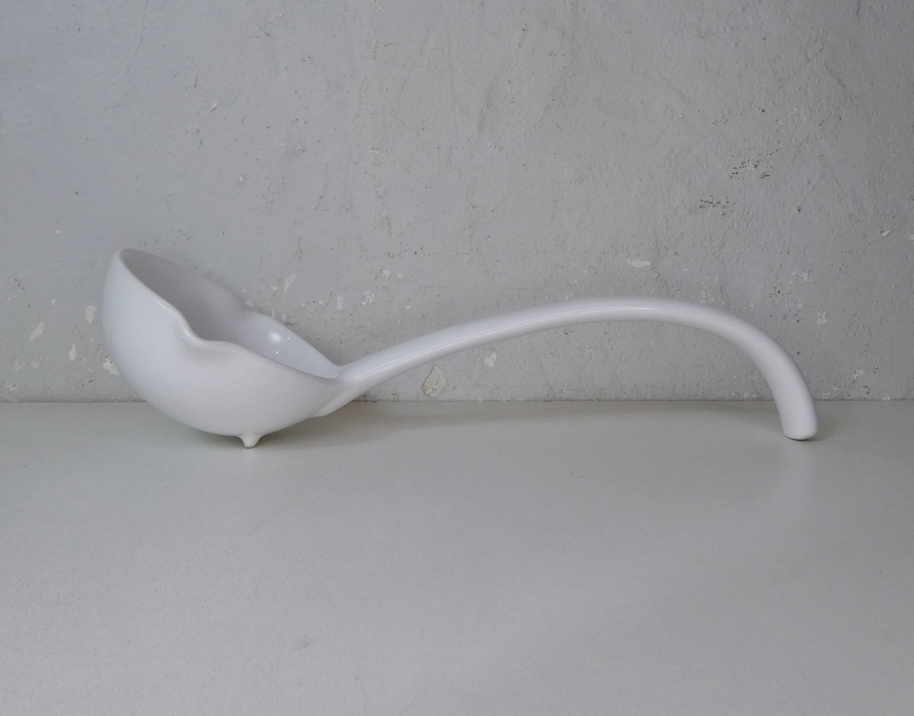 White ceramic ladle