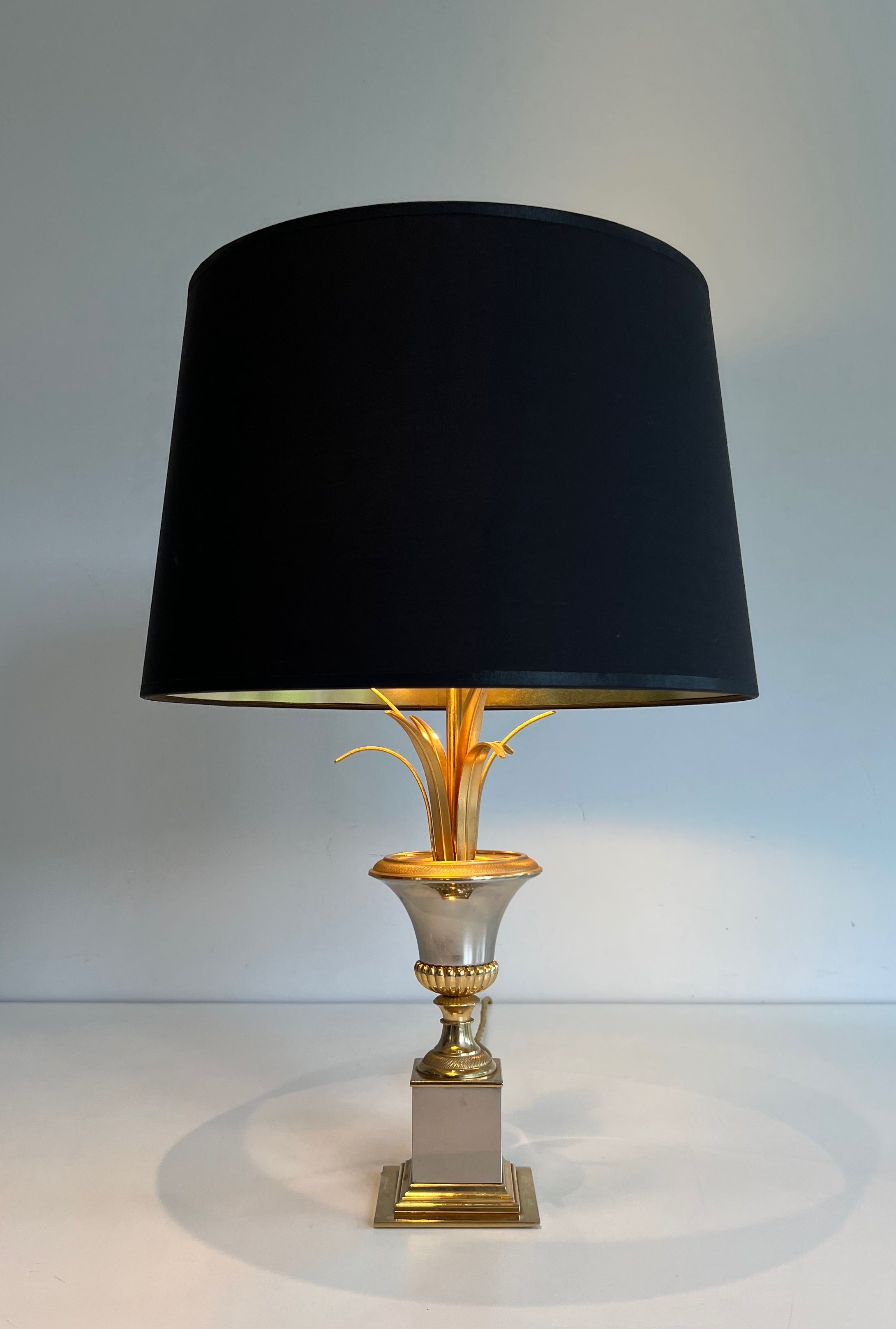 Pair of palm lamps in chrome and brass in the style of Maison Charles. Circa 1970.