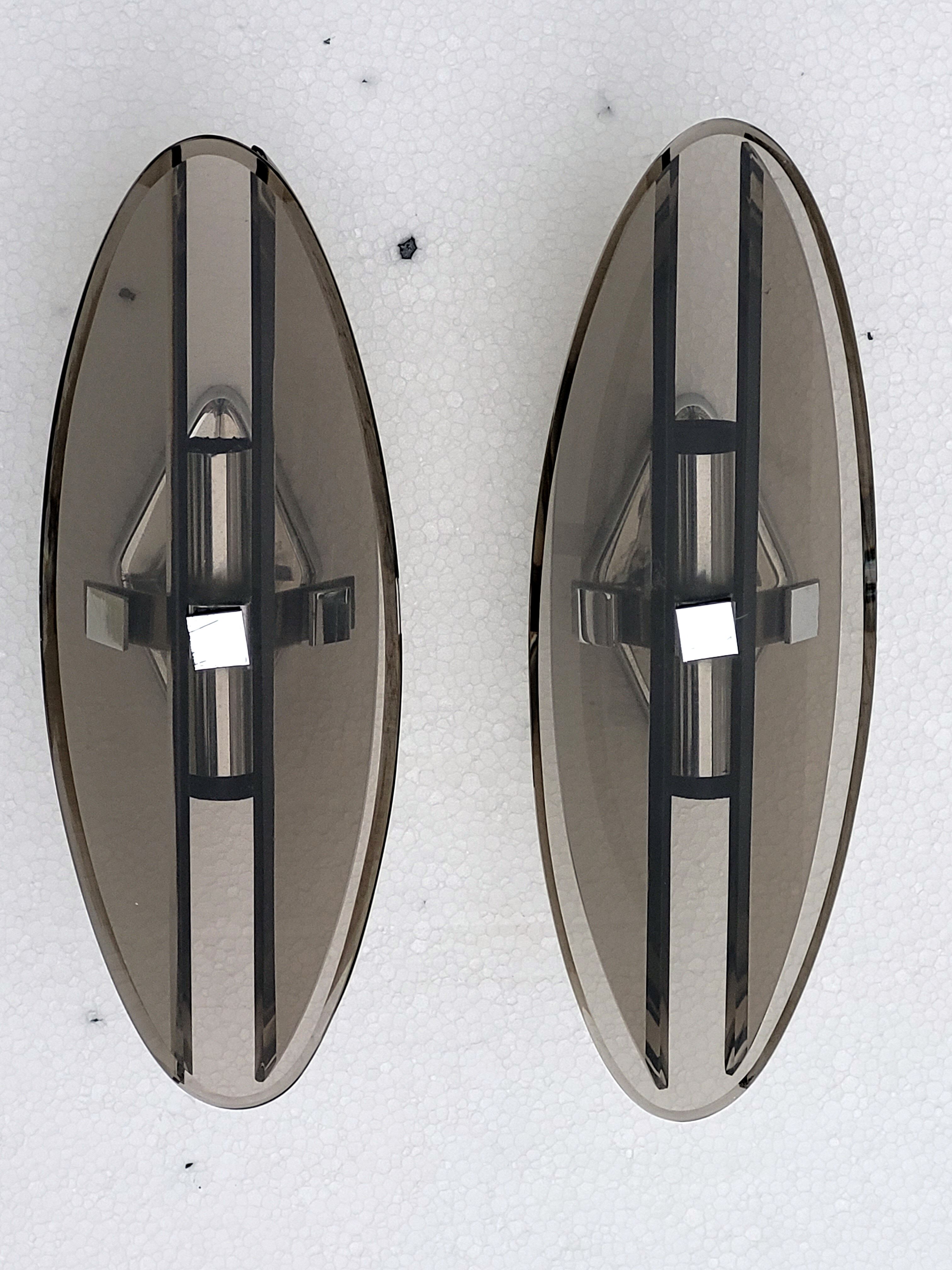 Pair of elliptical italian wall lamps in smoked glass and chrome veca