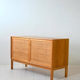 Scandinavian oak cabinet with woven rattan doors