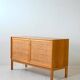 Scandinavian oak cabinet with woven rattan doors
