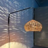 Mid-century modern Danish extendable cantilever wall lamp with a rattan shade, 1960s.