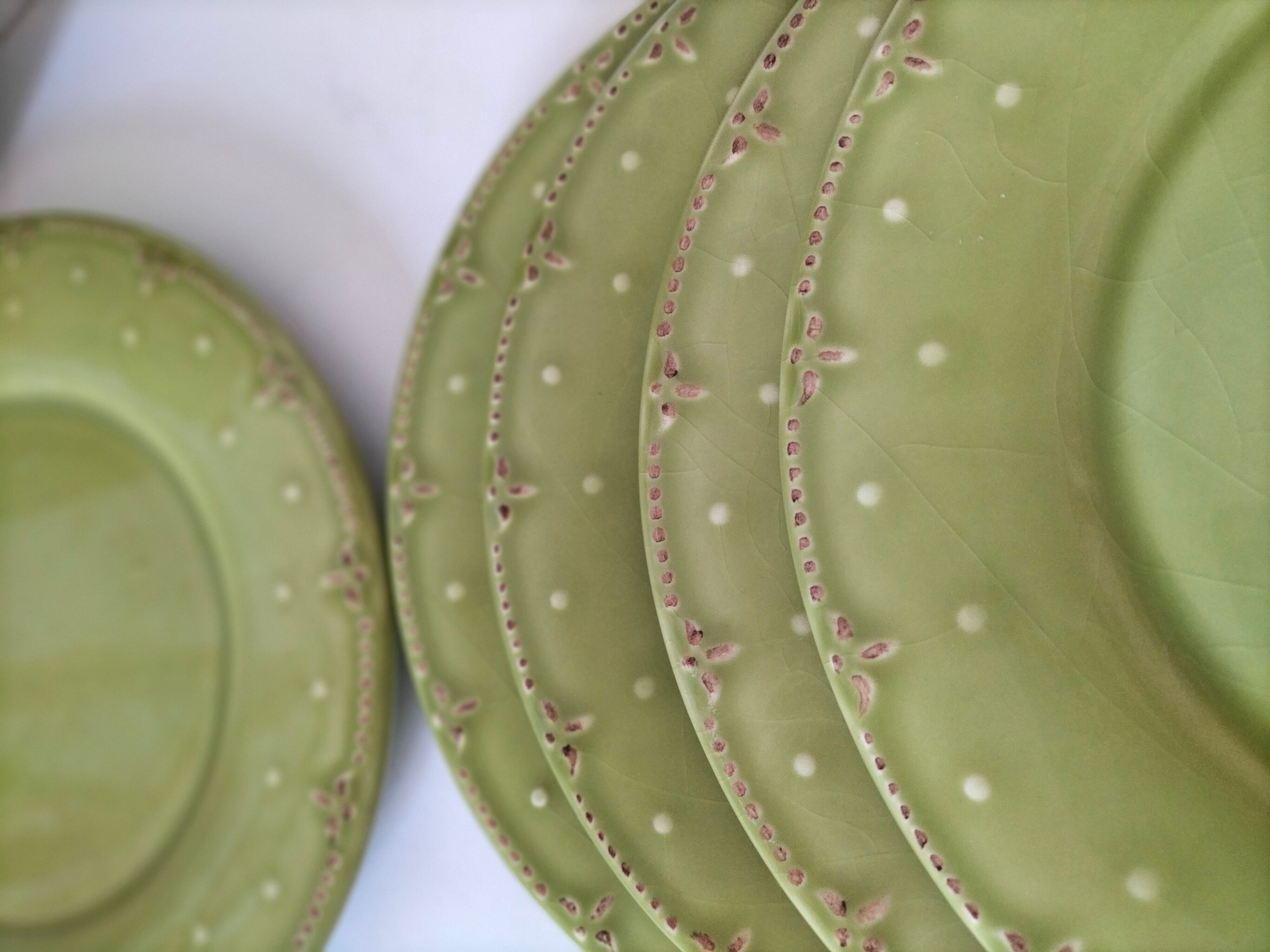 6 olive green plates with dotted relief, workshop ceramic style