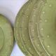6 olive green plates with dotted relief, workshop ceramic style