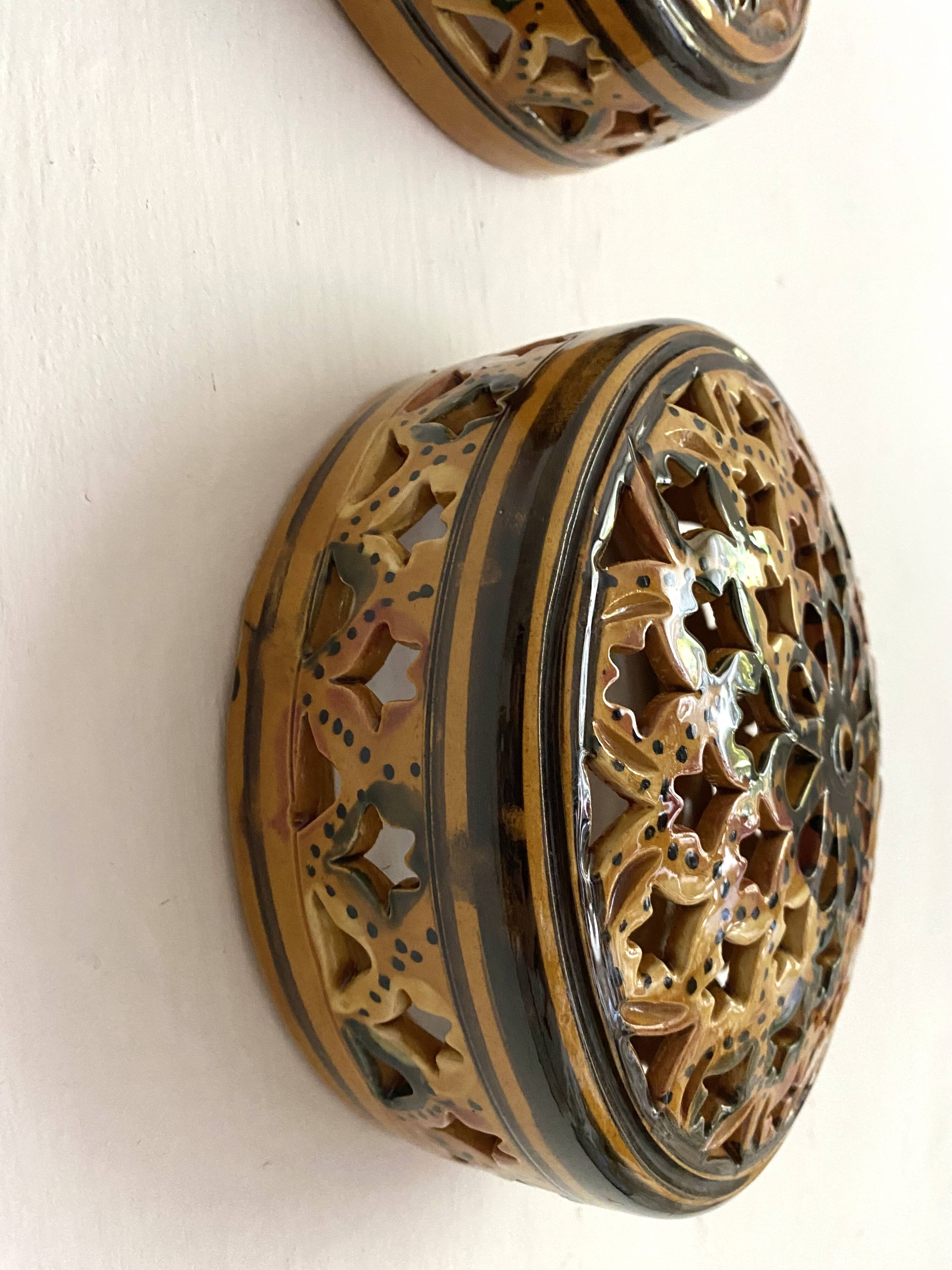 Pair of enamelled terracotta wall lights