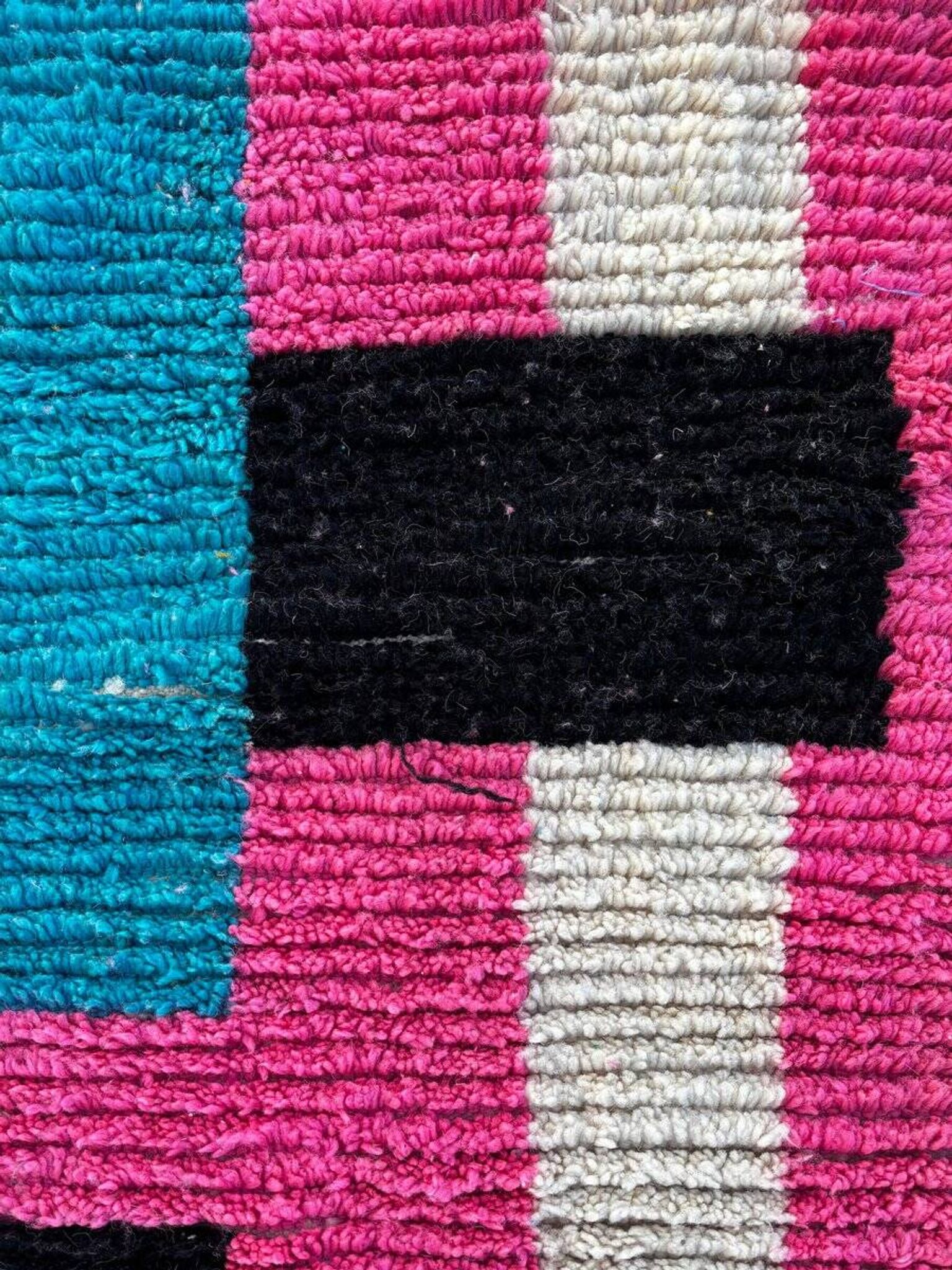 Moroccan Berber rug corridor in pink and blue wool.