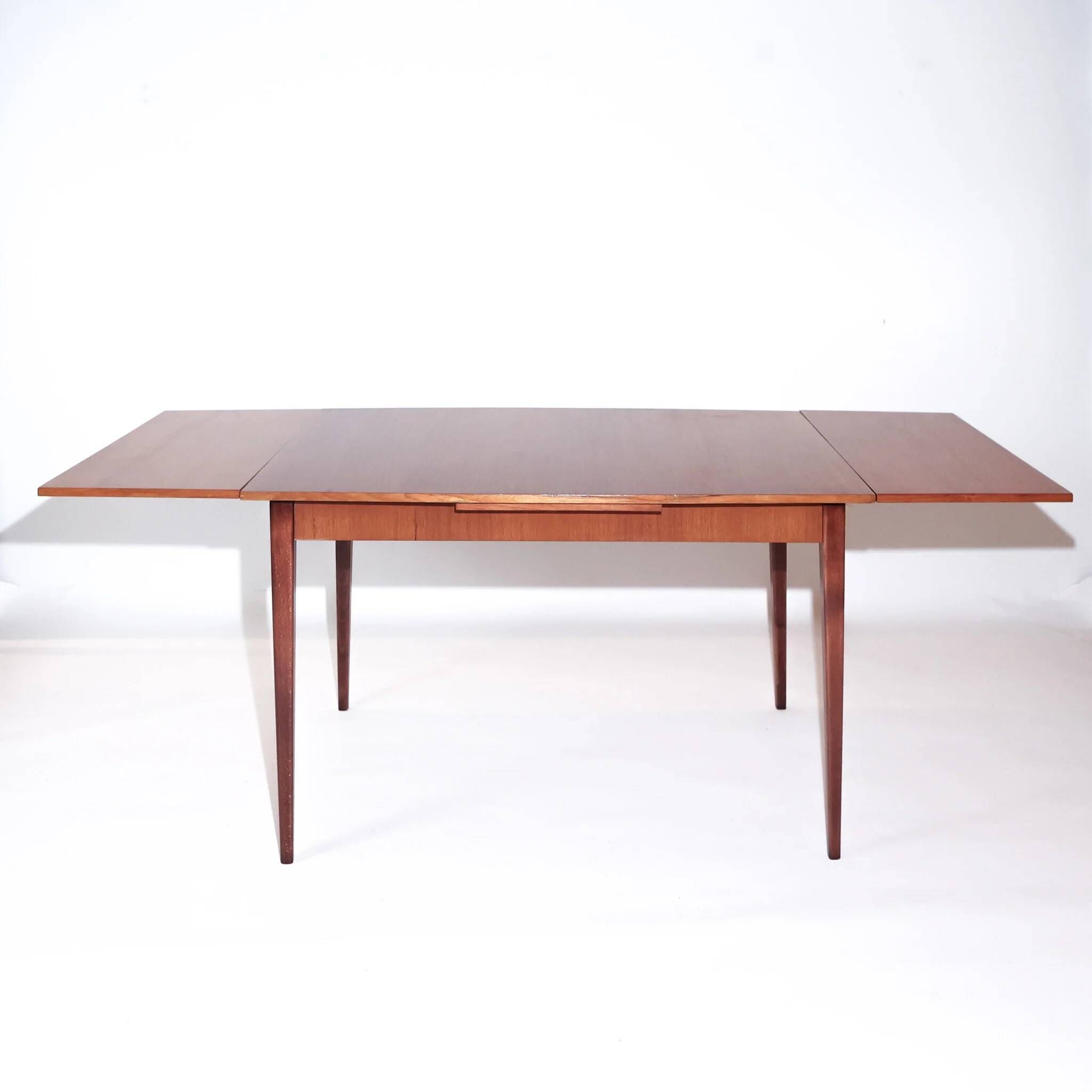 Mid-century modern Scandinavian dining table with extensions in teak, 1960s.