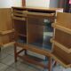 Bar cabinet opening with 2 doors from the 1950s.