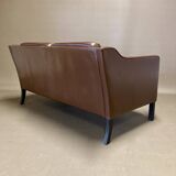 Scandinavian design 2-seater leather sofa.