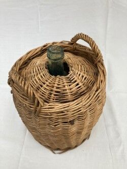 Demijohn type canister covered in wicker