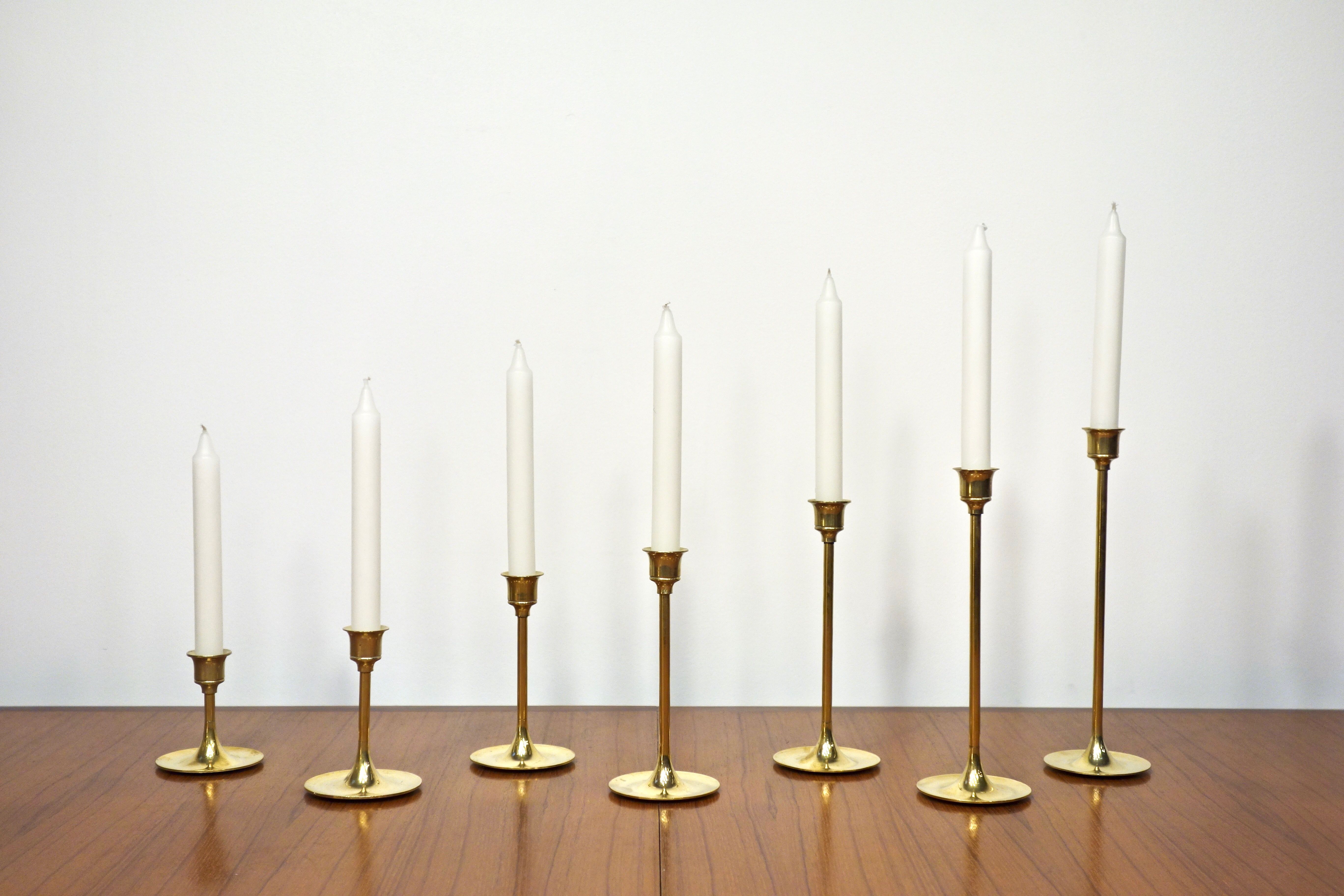 Set of 7 Scandinavian brass candle holders, 1960's