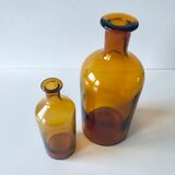 Duo of ancient apothecary flakes in amber glass
