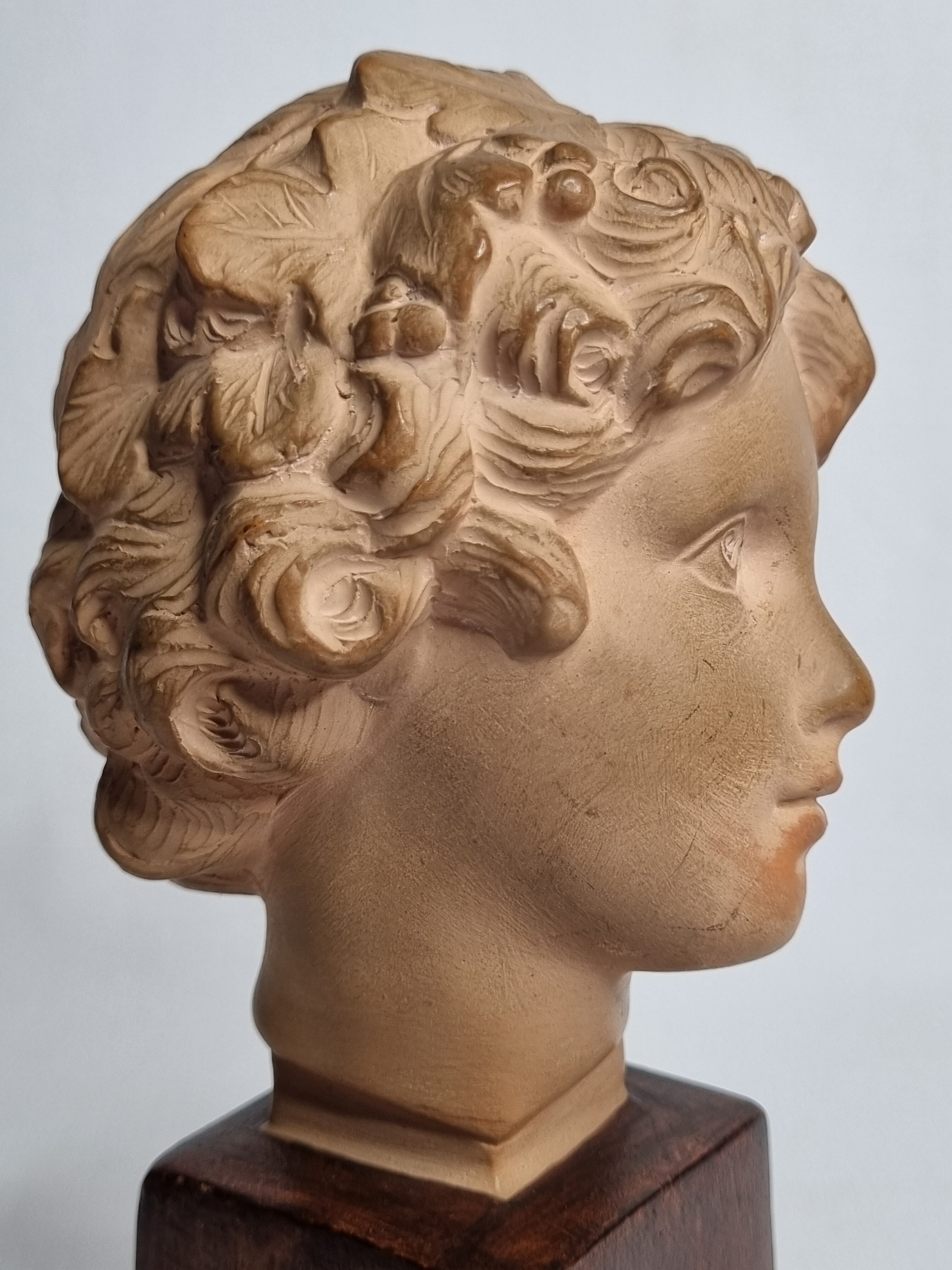 Bust of Bacchus child in patinated terracotta, 21 cm