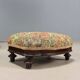 Victorian armchair with fabric pouf, England, 19th century.