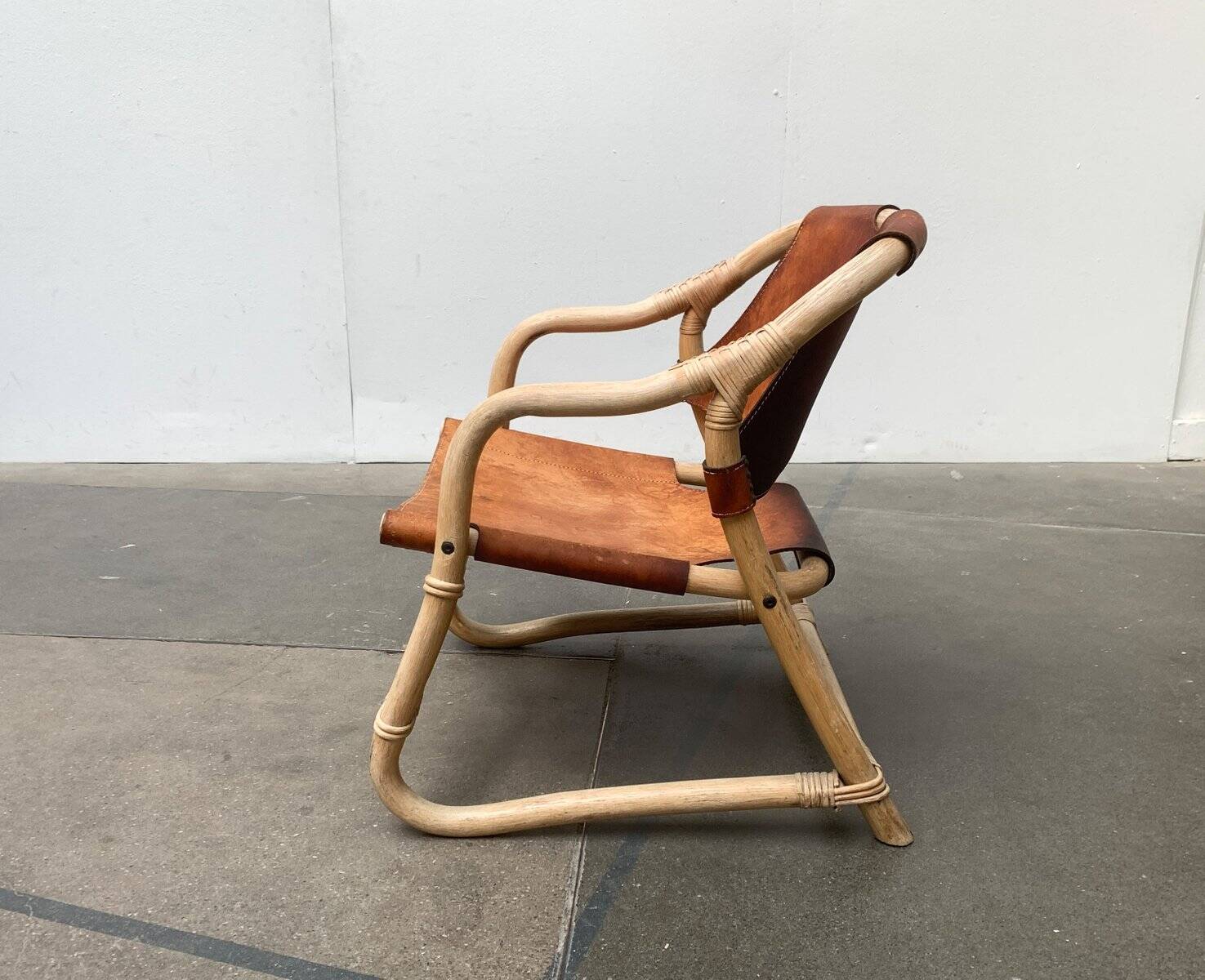 Mid-century safari lounge chair in bamboo and Danish leather, 1960s.