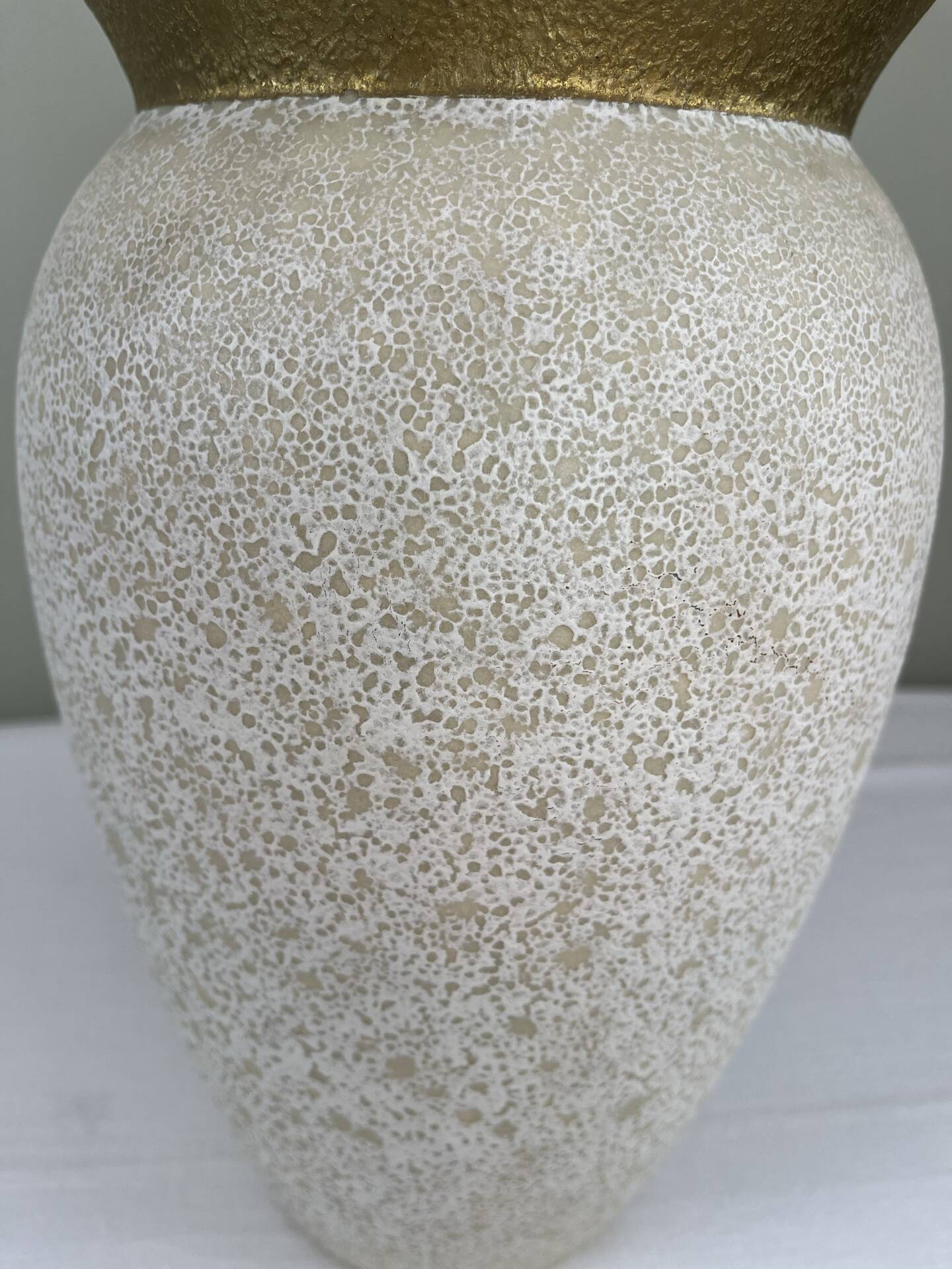 Cream speckled glazed vase with a gold rim, 1970s.
