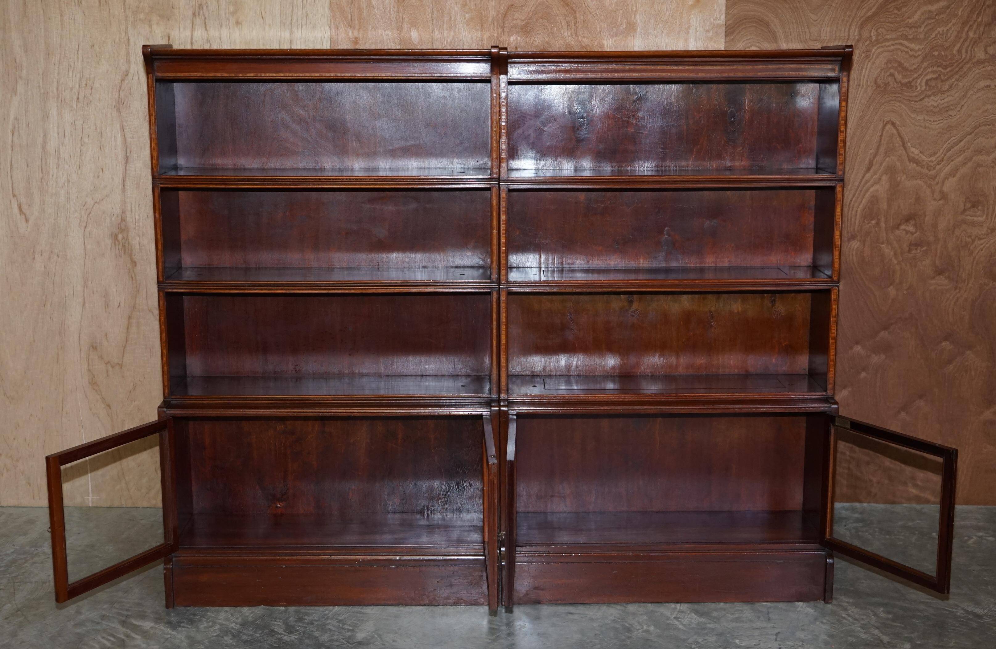 Antique pair of legal bookcases by William Baker Co in hardwood, satin and walnut.