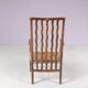 1930s small low spindle-back hearth chair / side chair with wicker seat, Arts & Craft Movement, Morris & Co for Liberty and Co, Stowaway London