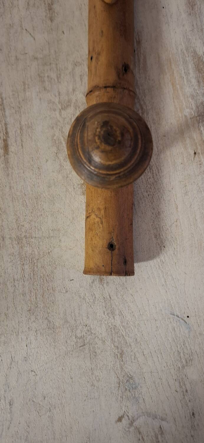 Turned wooden coat rack.