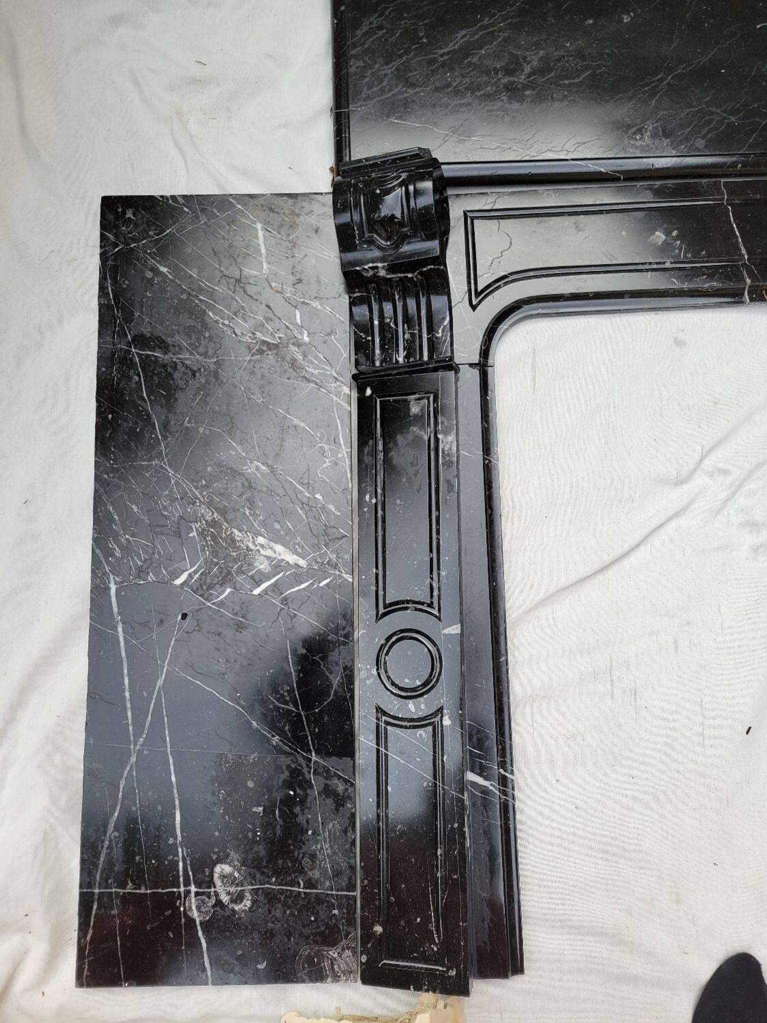 Pompadour fireplace with black marble modillions