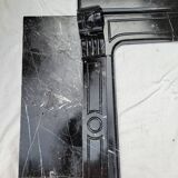 Pompadour fireplace with black marble modillions
