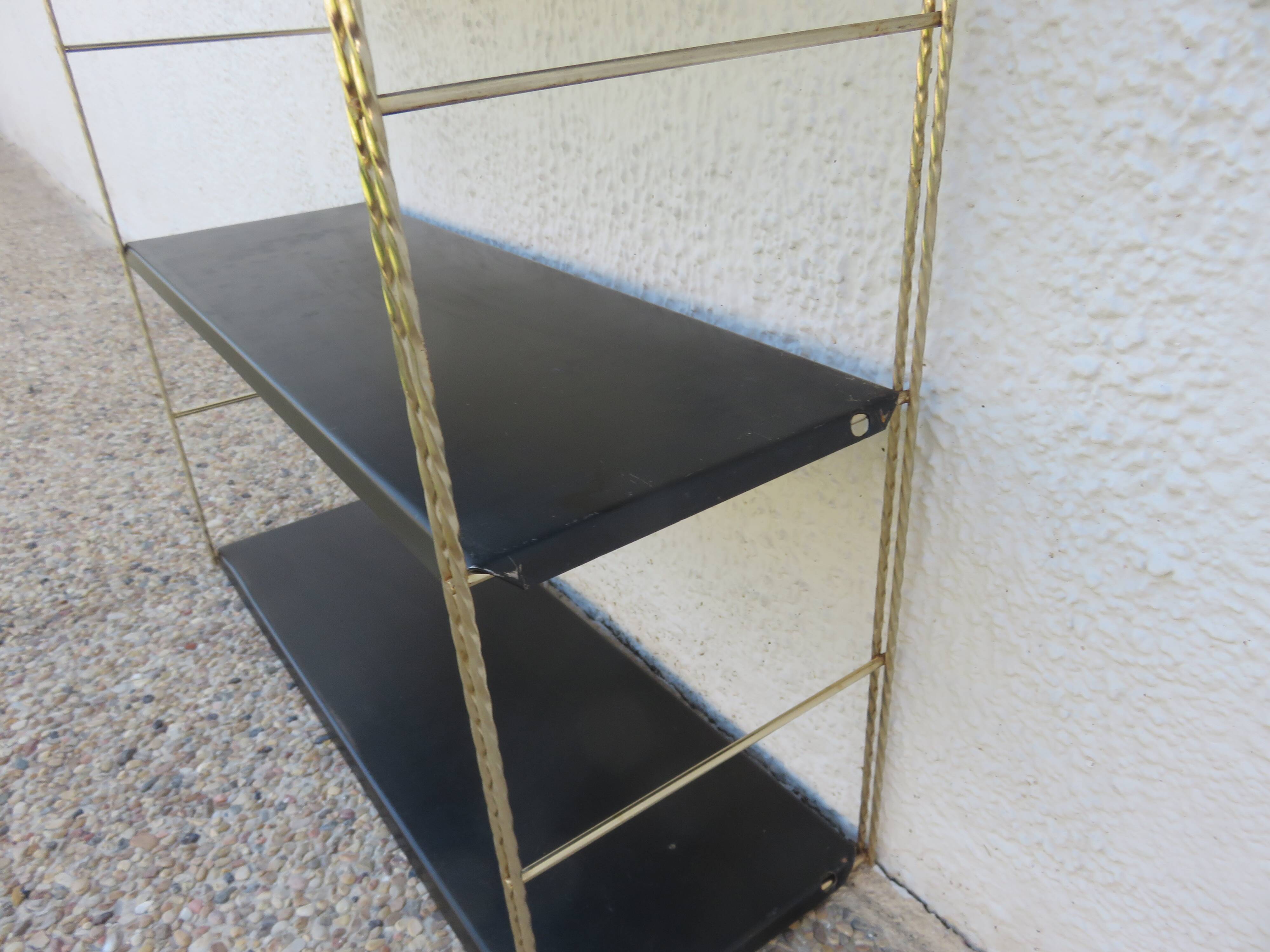 Modular String shelf in gold and black metal