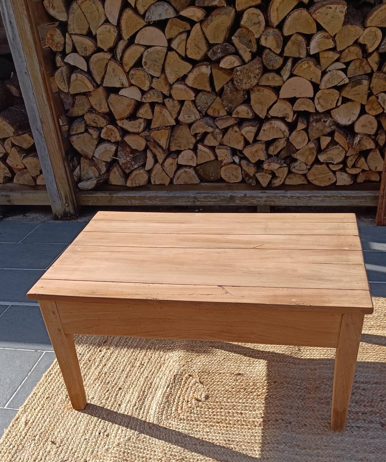 Low farmhouse table in raw wood