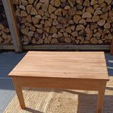 Low farmhouse table in raw wood