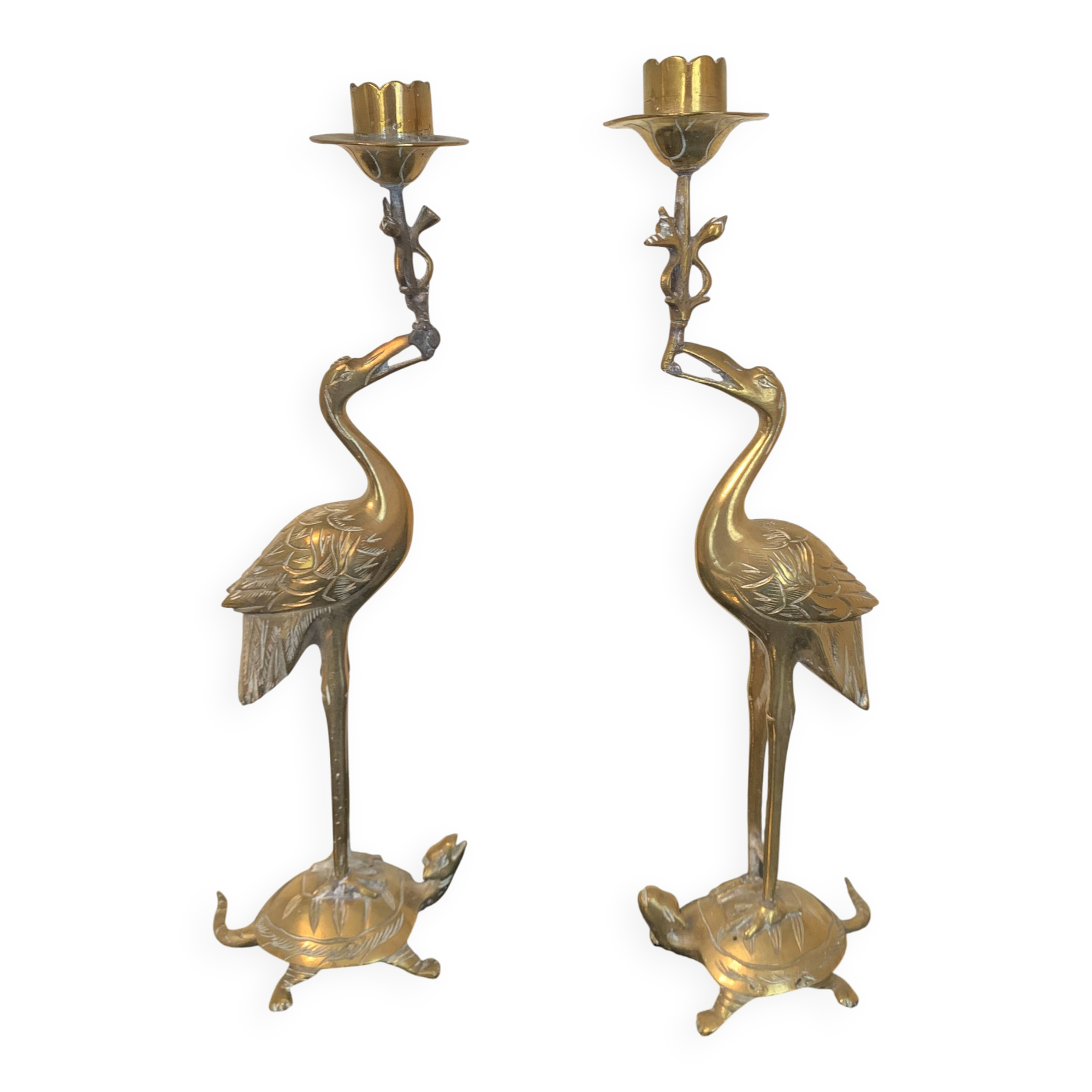 Pair of chiseled and gilded bronze candlesticks depicting perched waders