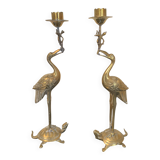 Pair of chiseled and gilded bronze candlesticks depicting perched waders