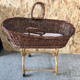 Old woven wicker baby cradle