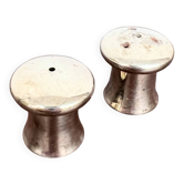 Mushroom-shaped salt and pepper shaker set in silver-plated metal.