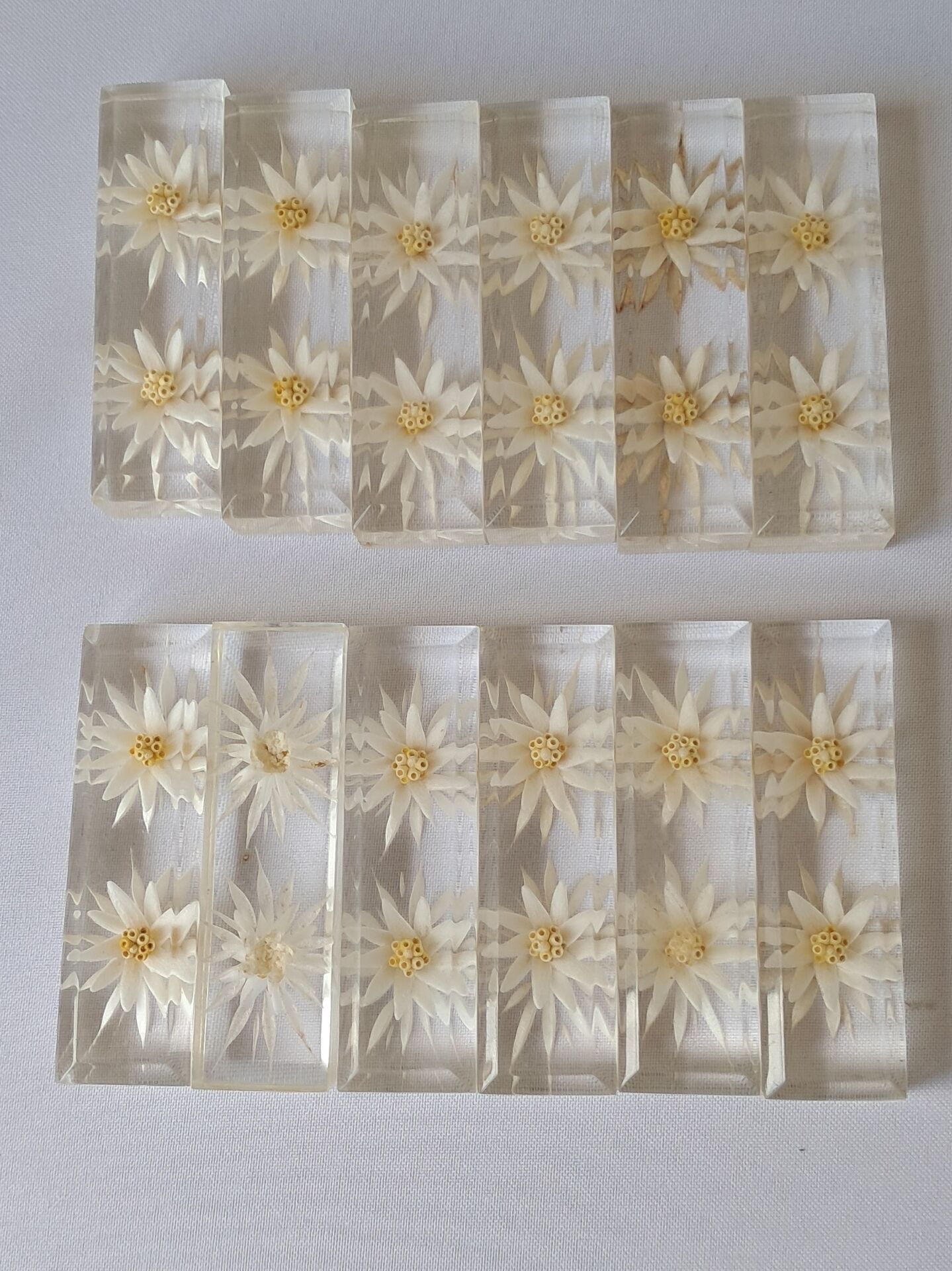 12 knife rests with resin inclusion. 1970s.