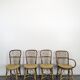 Set of 3 chairs and a rattan armchair.