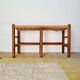 Old wooden and straw bench