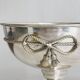 shiny silver metal cup on foot