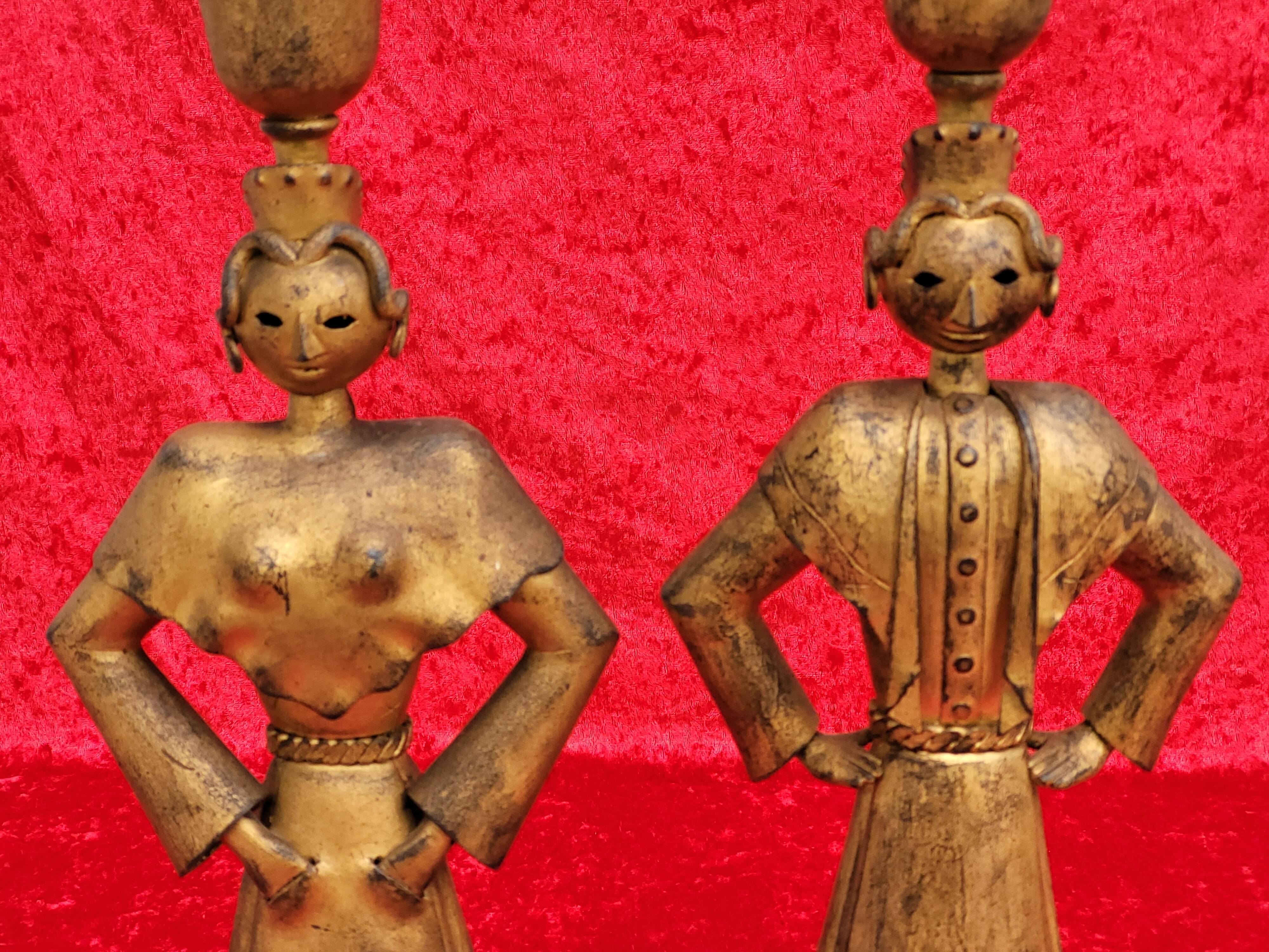 Pair of gilded beaten iron sculpture lamps attributed to Gilbert Poillerat
