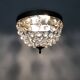 Old crown ceiling light with 2 bulbs, half basket with glass pendants.