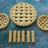2 yellow ceramic trivets and knife rests
