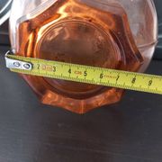 Vintage glass carafe in pink-orange, retro-chic style.