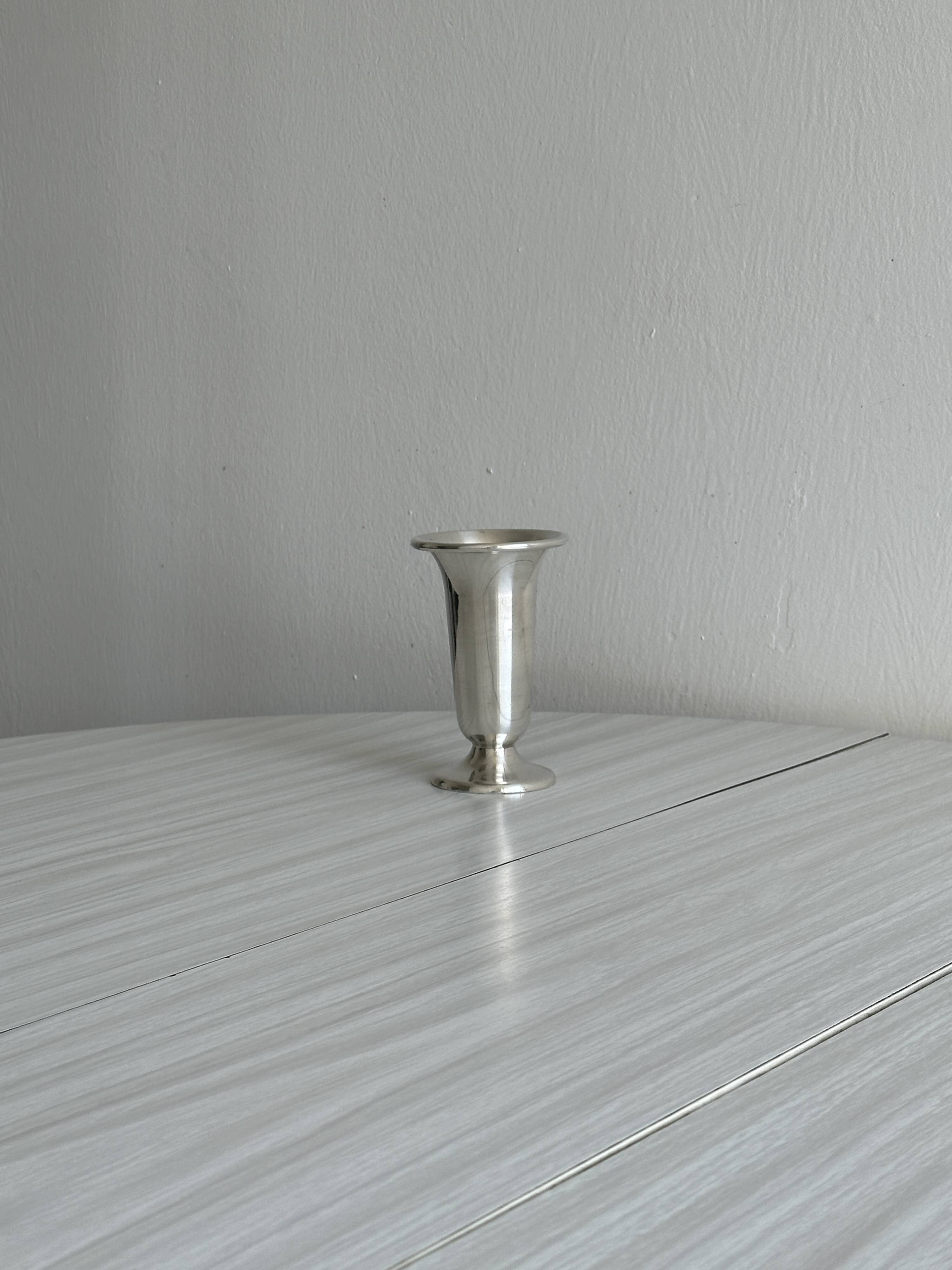 antique vase in shiny silver metal