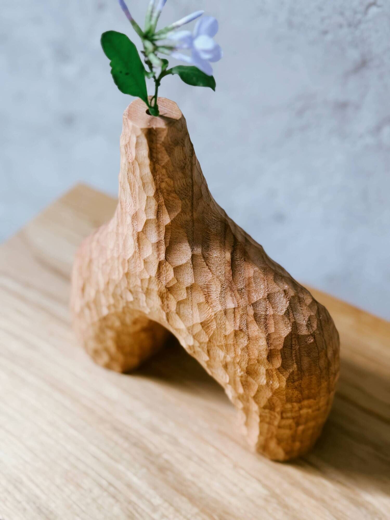 Hand-carved soliflore vase in solid chestnut wood.