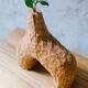 Hand-carved soliflore vase in solid chestnut wood.