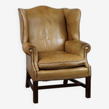 Unique patinated cowhide wingback armchair