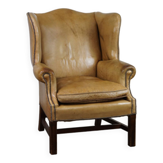 Unique patinated cowhide wingback armchair