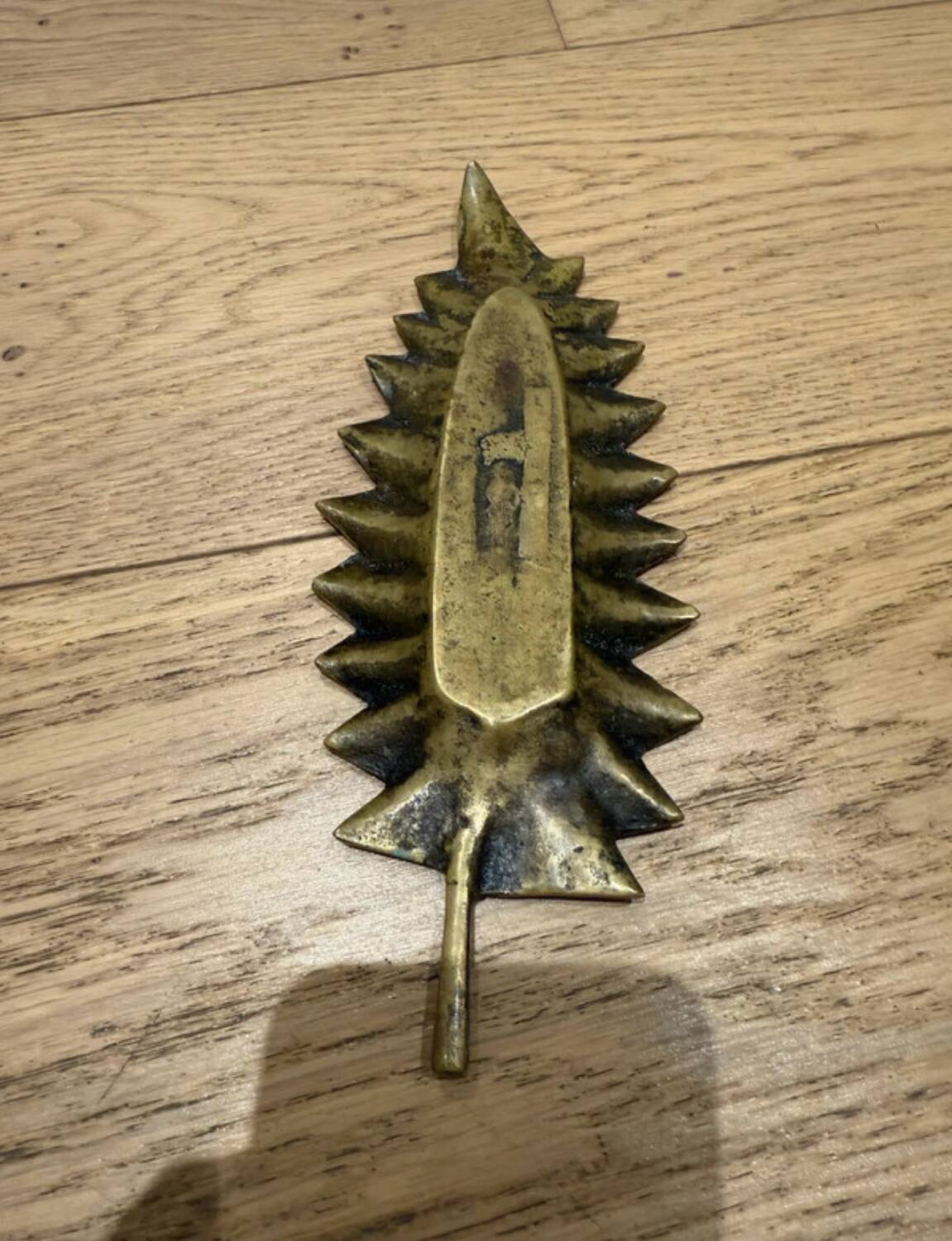 Brass pocket emptier